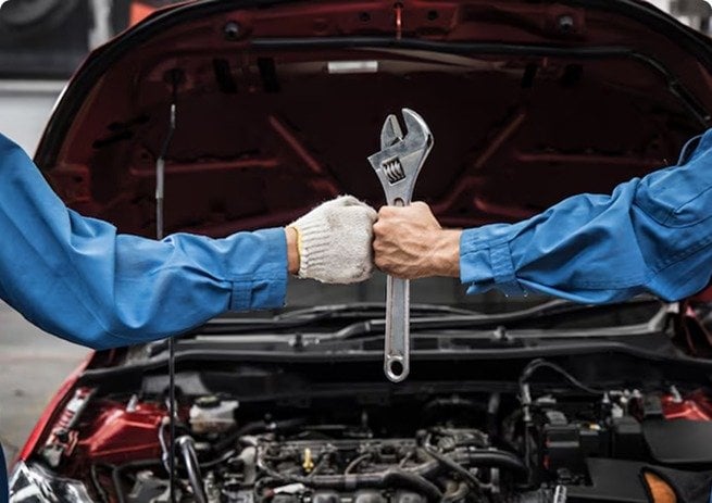 Technician working on a car